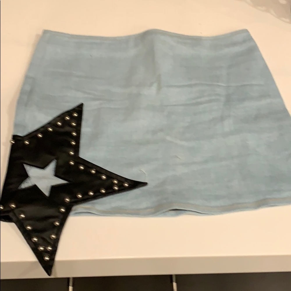 Super cute blue skirt with black studded star!